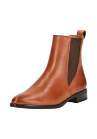 Bottine en cuir marron avec un design épuré, panneaux latéraux élastiques, bout pointu et petit talon carré. Texture lisse avec un minimum de détails.
