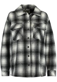 Svart och vit rutigt flanellskjorta med två framfickor, knäppning och krage. Mjuk textur och lös passform med långärmar.