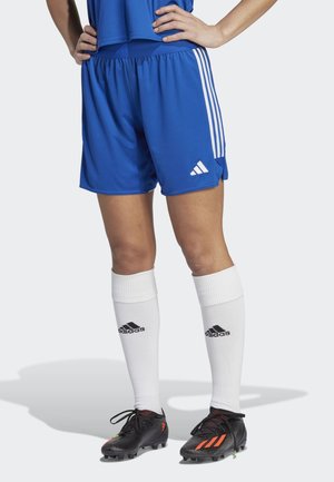 Blue athletic shorts with white stripes, elastic waistband, and Adidas logo; paired with white socks and black cleats featuring orange accents.