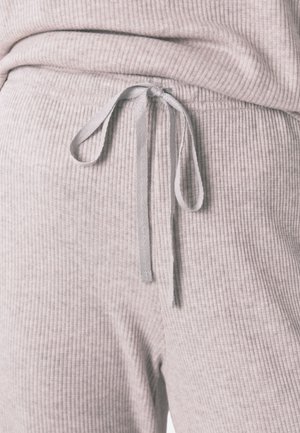 Comfortabele, lichtgrijze geribde sweatpants met een verstelbare tailleband en een gestructureerde stof. Kenmerkt zich door een ontspannen pasvorm en een elastische zoom.
