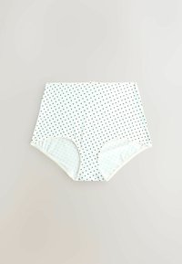 Culotte haute blanche pour femme avec petits motifs de cœurs noirs et bordures élastiques sur un fond neutre.