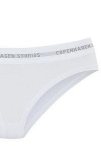 White cotton brief featuring a soft elastic waistband with "Copenhagen Studios" printed in gray. Smooth texture and a classic cut.