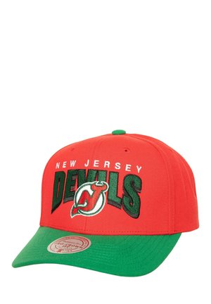 Red baseball cap with green brim, featuring "New Jersey DEVILS" in white and green embroidered text and a logo on the front.