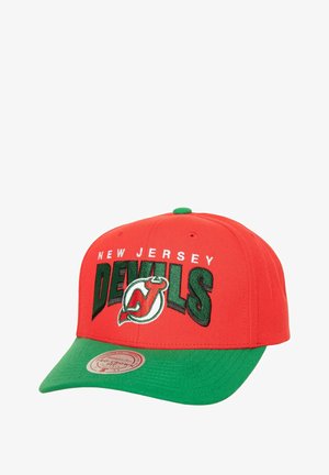 Red baseball cap with green brim, featuring "New Jersey DEVILS" in white and green embroidered text and a logo on the front.
