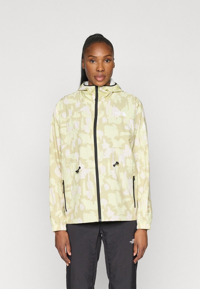 Ανοιχτό πράσινο μπουφάν με αφηρημένα κρεμ σχέδια, ρυθμιζόμενη κουκούλα, μαύρο φερμουάρ, ελαστικά μανίκια και κορδόνι στο κάτω μέρος. Διαθέτει λογότυπο στο στήθος.