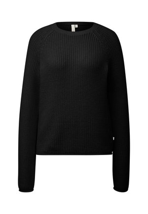 Mustmustööst valmistatud must sviiter, millel on ümar kaelus, pikad raglaansleevid, tekstuuriga kangas ja sirge lõige. Omab minimalistlikku disaini ja diskreetset sildi.