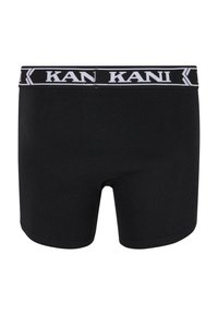 Boxeri negri din bumbac, cu un bandou elastic lat pe care este inscripționat numele brandului "KANI" cu litere albe.