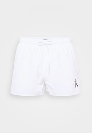 Weiße Badeshorts mit einem elastischen Bund, Kordelzug und einem grauen "ck"-Logo auf der unteren linken Vorderseite. Glatte Textur, klassisches Design.