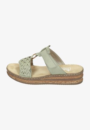 Hellgrüne Leder-Sandalen mit geflochtenem Obermaterial, gepolstertem Fußbett und einem gestapelten Korksohle. Akzentuiert mit einem dekorativen Schlaufen-Detail.