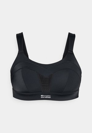 Melna sporta krūšturis ar strukturētu dizainu, kuram ir platas siksnas, V-veida priekšpanele un logo malā. Izgatavots no gludas, elastīgas auduma.