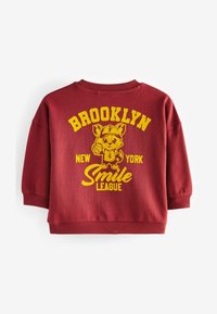 Next VARSITY   czerwony