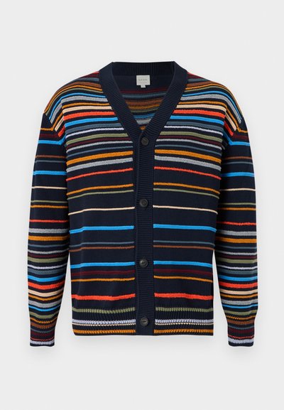 Καρντιγκάν σε ναυτικό μπλε χρώμα με πολύχρωμες οριζόντιες ρίγες, V-λαιμόκοψη, μακριά μανίκια και μαύρα κουμπιά μπροστά.