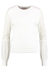 Weißer Strickpullover mit durchsichtigen Spitzenärmel, die mit floralem Stickerei und gefältelten Akzenten verziert sind. Rundhalsausschnitt und gerippter Saum. Leichter Stoff.