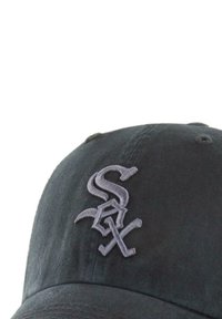 Black baseball cap made of cotton twill, featuring a raised gray embroidered "S" logo on the front and stitched eyelets for ventilation.
