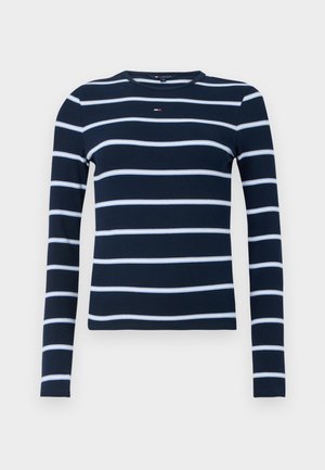 Camicia a maniche lunghe blu navy con righe orizzontali bianche e piccolo logo rosso, bianco e blu sul petto.