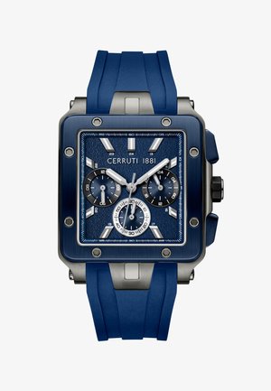 Cerruti 1881 rokas pulkstenis ar kvadrātveida tumši zilu korpusu, teksturētu ciparnīcu, sudraba akcentiem un zilu gumijas siksniņu ar teksturētu apdari.