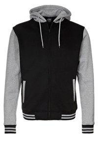 Felpa nera con zip e maniche e cappuccio grigi. Presenta polsini e orlo a coste con dettagli a righe. Due tasche sul davanti.