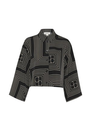 Black cropped shirt featuring a geometric white line pattern, button-up front, and collared neck with three-quarter length sleeves.