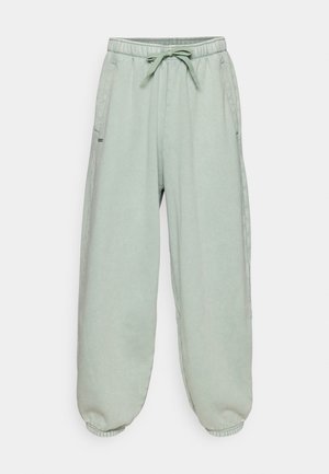Under Armour ICON WASH PANT - Tracksuit bottoms - silica green/white