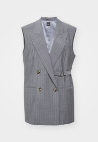 Harmaa raitapintainen hihaton bleiseri, jossa on kaksinkertainen etuosa, kaksi nappia, sivutaskut ja vyötärökaitale. Vuorattu sisustus.