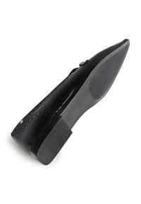 Black patent leather shoe with a pointed toe, intricate perforated design along the edge, and a textured black rubber sole.