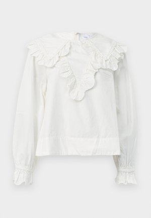 White long-sleeve shirt with a large ruffled collar and ruffled cuffs, featuring a V-shaped neckline and a soft, textured fabric.