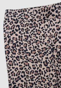 Tessuto a fantasia leopardata in beige e nero, caratterizzato da varie forme irregolari. Vita elastica con una superficie liscia.