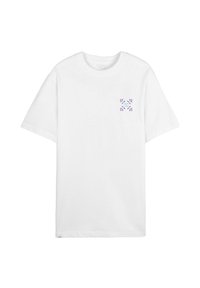 T-shirt en coton blanc à coupe décontractée. Présente un petit motif floral violet sur la poitrine gauche. Col rond classique.