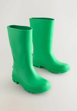 Vihreät kumiset sadetakki saappaat, joissa on korkea muotoilu, teksturoitu pohja ja sileä pinta. Mukana pyöreä kärki ja litteä korko.