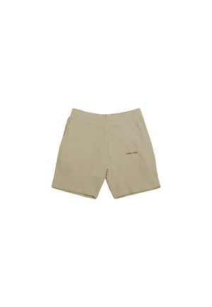 Beige shorts with a textured pattern, elastic waistband, two side pockets, and subtle logo on the front. Stretchy, casual fit.