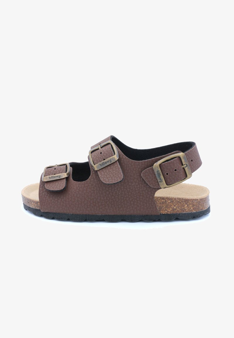Sandale marron texturée avec deux sangles réglables et boucles en bronze. Semelle en liège et semelle en caoutchouc foncé pour plus de confort et de stabilité.