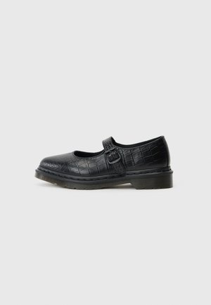Black Mary Jane shoe with a crocodile texture, round toe, flat sole, and a side buckle strap. The material appears glossy and smooth.