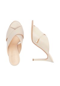 Beige læder højhælede mules med krydsede stropper. Åben tå-design og en slank stiletto-hæl. Glat tekstur med et minimalistisk æstetik.