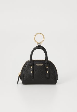 Small black pebbled leather Kate Spade handbag keychain with double handles, gold zipper, studs, and large gold keyring attachment.