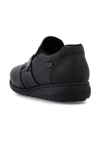 Czarne skórzane buty wsuwane z gładkim wykończeniem, zaokrąglonym noskiem, regulowanym paskiem oraz teksturowaną gumową podeszwą dla lepszej przyczepności.