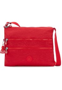 Röd tyg crossbody-väska med två zip-fack, en texturerad yta och en rund logotypapplikation. Inkluderar en avtagbar monkeynyckelring.
