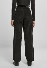 Urban Classics LADIES HIGH WAIST 90´S WIDE LEG CORDUROY PANTS - Kalhoty - black