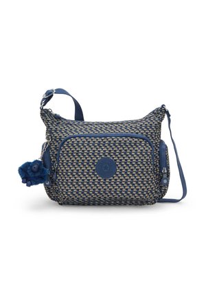 Blå og beige vævet skuldertaske med justerbar rem, to lommer med lynlås og et rundt logo-mærke. Inkluderer en blå plys charm.
