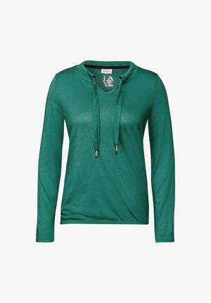 Vihreä pitkähihainen paita hupparityylisellä kauluksella, jossa on nyörit ja kultasävyiset metallikärjet. Silkkinen kangas, jossa on rento istuvuus.