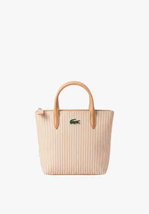 Petit sac cabas avec rayures verticales beige et blanches, poignées couleur cuir clair, fermeture éclair et logo crocodile vert sur le devant.