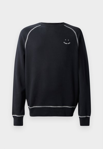 Svart sweatshirt med rund hals, långa ärmar och kontrasterande vit sömnad. Har en liten grafisk design på bröstet. Mjuk tyghand.
