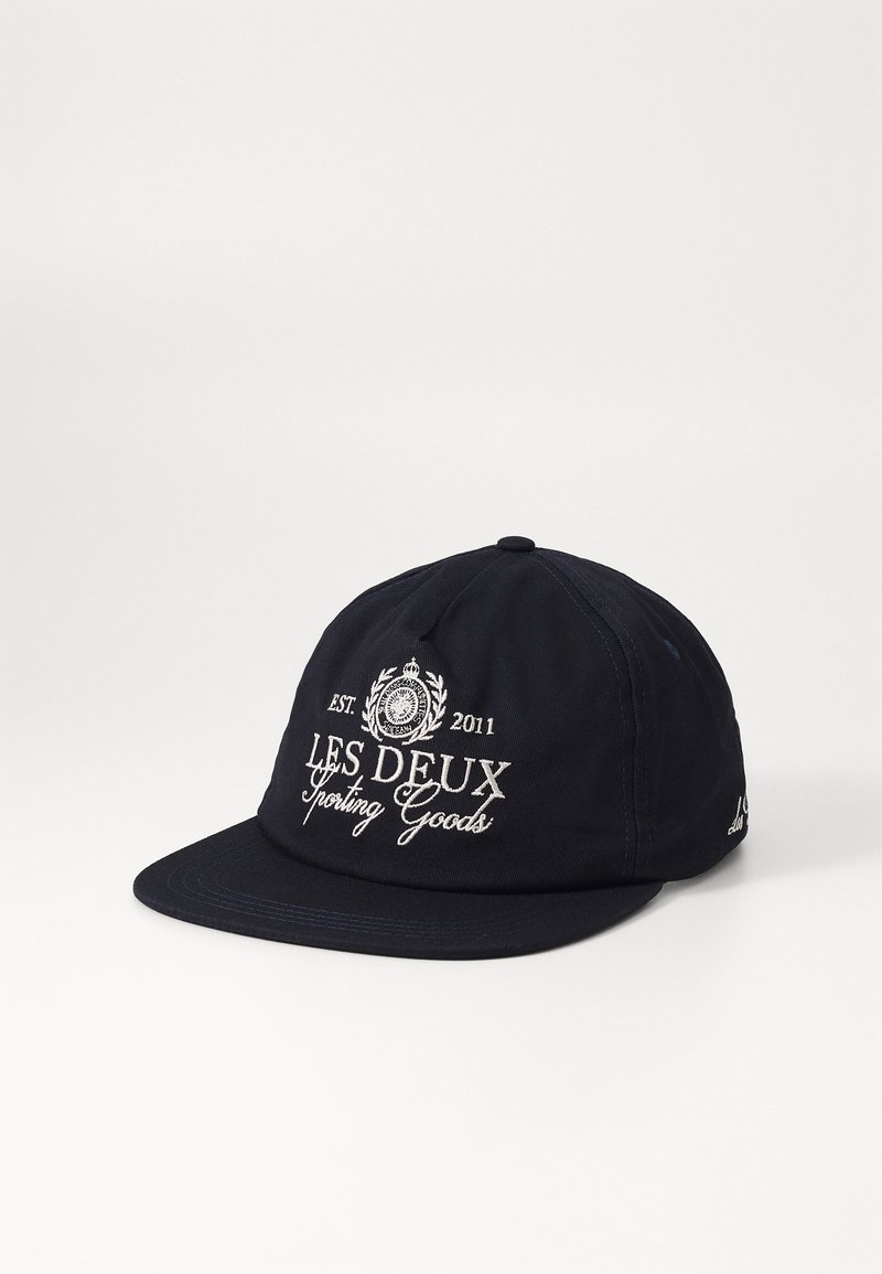 Navy blue cap made of cotton with a structured design. Features embroidered text "LES DEUX Sporting Goods" and a logo on the front.