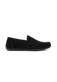 Chaussures noires en suede à enfiler avec une semelle en caoutchouc basse, dotées d'un bout arrondi et de détails de couture minimalistes sur le dessus.
