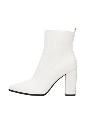 White ankle boot with a textured, crocodile pattern, pointed toe, and a clear block heel. Features a loop tab at the back for easy wear.