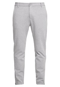 Szare spodnie dresowe o wąskim kroju, wykonane z miękkiego materiału. Zapięcie na guzik, boczne kieszenie oraz zwężane nogawki nadają nowoczesny wygląd.