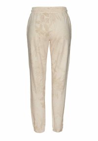 Beige Hosen mit floralen Mustern, einem elastischen Bund und schmal zulaufenden Beinen, aus weichem Stoff gefertigt und mit feiner Textur und Details versehen.
