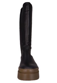 Black knee-high boot with a smooth leather upper, round toe, and a flat brown platform sole. Features a side zipper for easy wear.