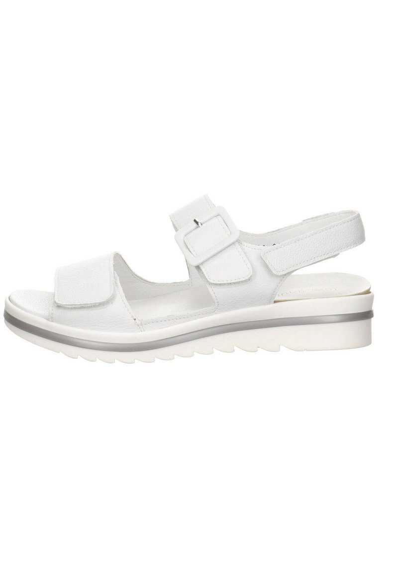 White sandal featuring a textured upper, two adjustable buckles, and a cushioned sole with a ridged pattern. Total heel height is approximately 3 cm.