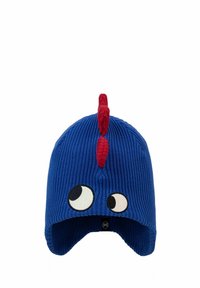 Blue knit hat with large cartoon eyes and red fabric mohawk. Features ribbed texture and ear flaps, labeled with a black tag.