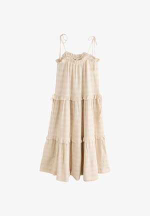 Robe beige sans manches à volants, avec fines bretelles à nouer et bords froncés, fabriquée en tissu léger texturé.